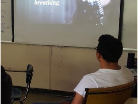 puerto rico classroom student looking at an image on screen from projector