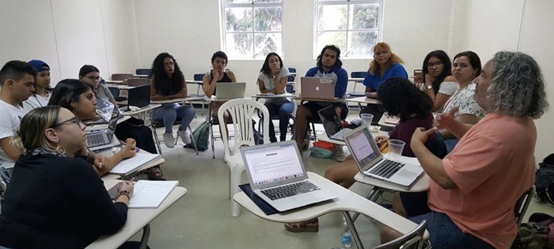 students sitting in a circle in a classroom