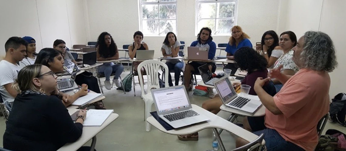 students sitting in a circle in a classroom